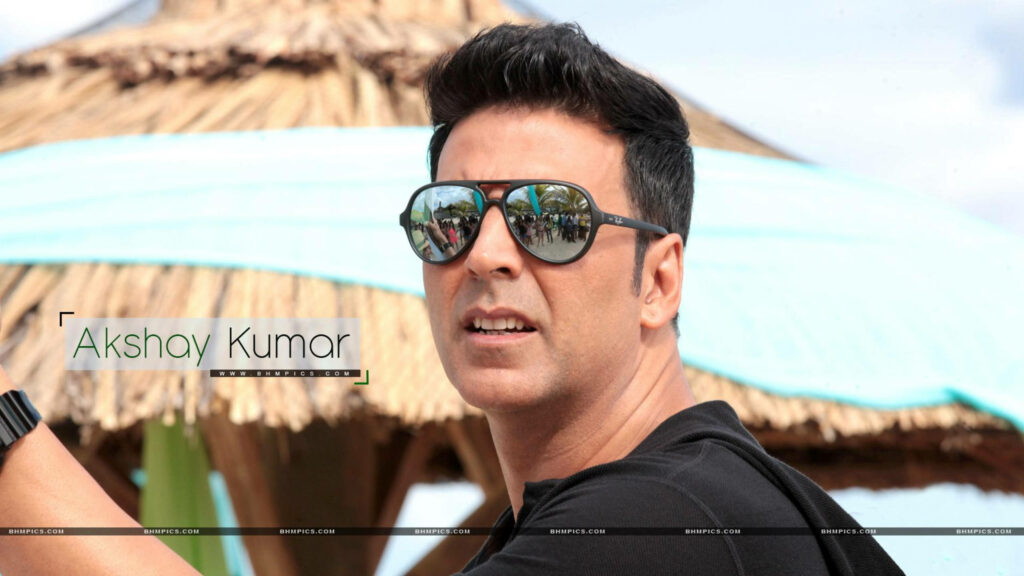 Akshay Kumar intense stylish look with sunglasses Bollywood action star tropical wallpaper background