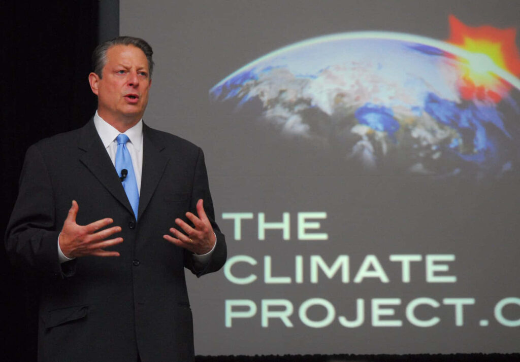 Al Gore speaking passionately at Climate Project Conference on global climate change awareness wallpaper