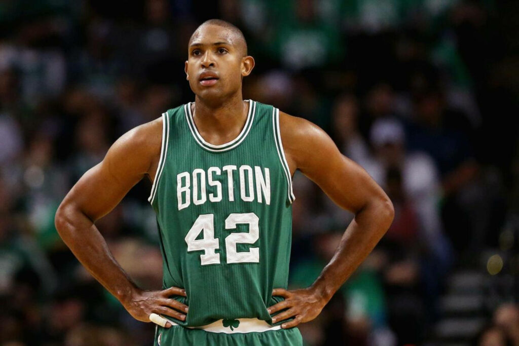 Al Horford in Boston jersey looking at scoreboard during intense basketball game wallpaper background