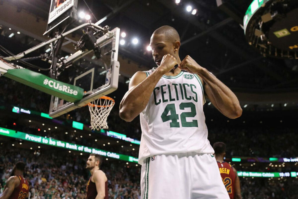 Al Horford Celtics jersey flex pose on court with cheering crowd vibrant basketball wallpaper background