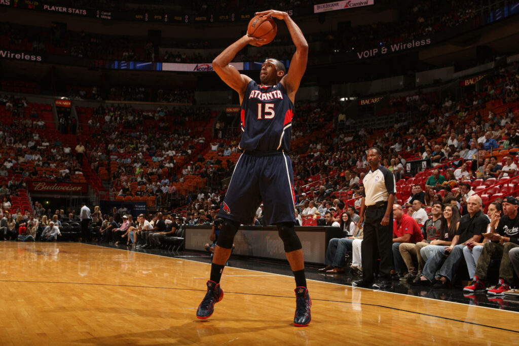 Al Horford focused shooting basketball during intense game action dynamic sports wallpaper