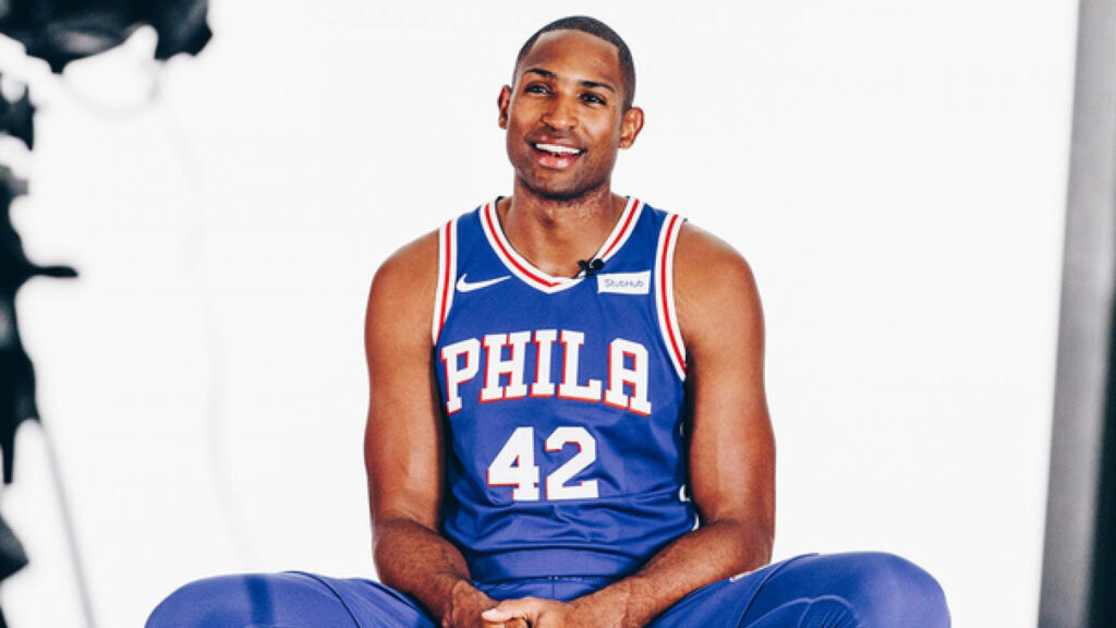 Al Horford in Philadelphia 76ers jersey during interview vibrant basketball wallpaper background