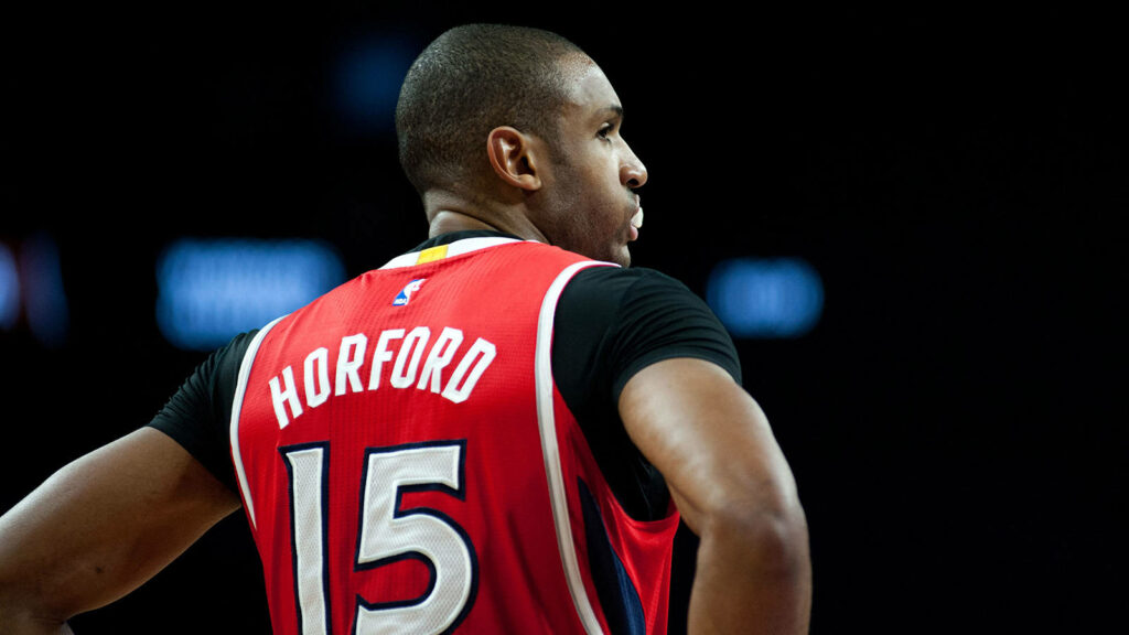 Al Horford NBA player in red jersey number 15 viewed from behind basketball wallpaper background