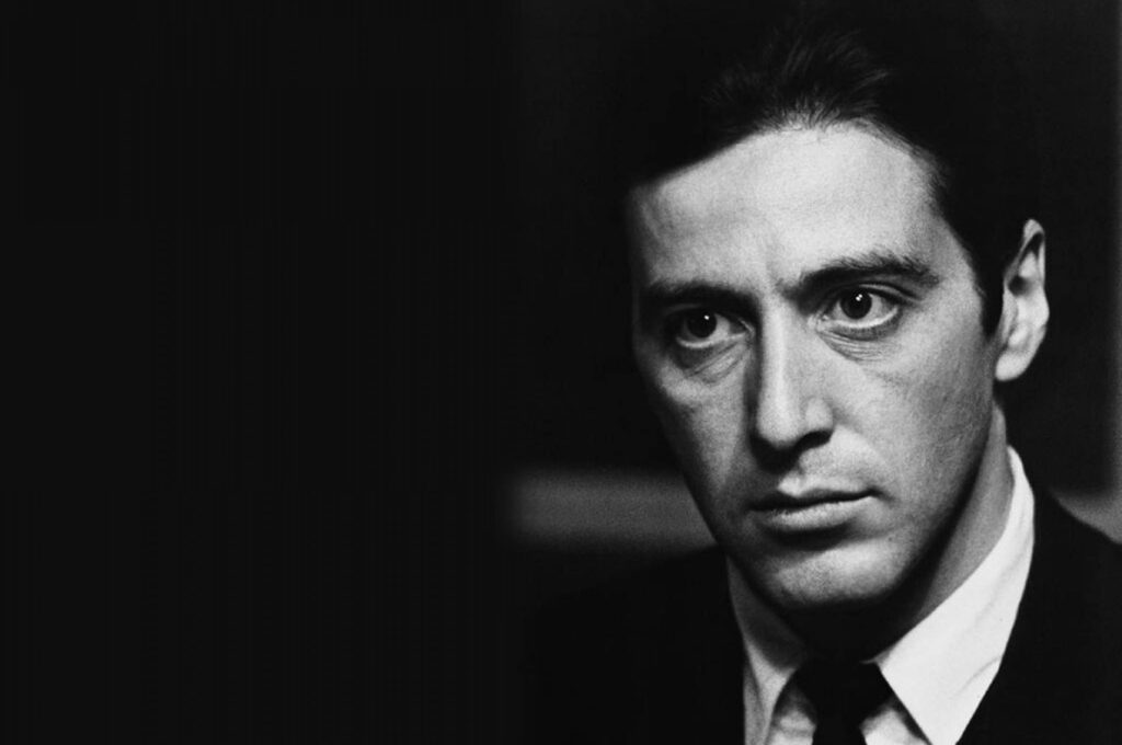 Black and white Al Pacino wallpaper with intense focused expression iconic powerful persona background