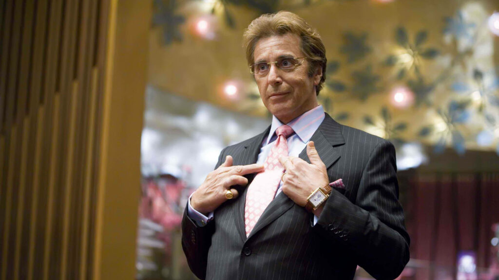 Al Pacino as Willy Bank in a sharp suit iconic movie scene wallpaper for fans background
