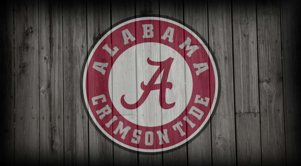 Alabama Crimson Tide football logo on rustic wooden background wallpaper for fans