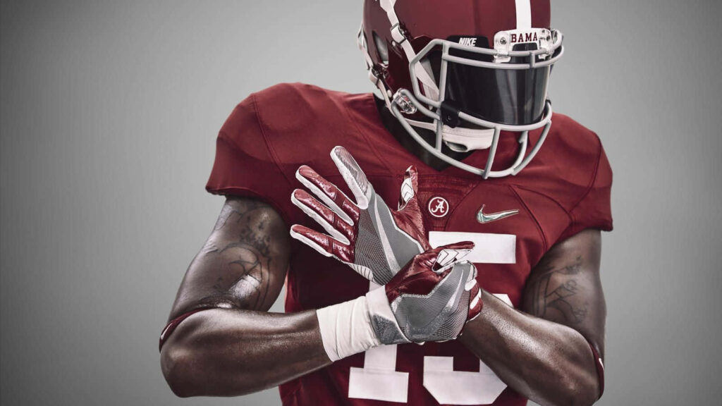 Alabama Crimson Tide football player in crimson white uniform digital art wallpaper background