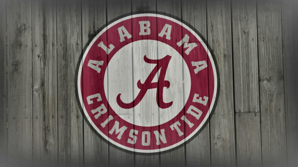 Alabama Crimson Tide logo on rustic wooden background wallpaper showcasing team spirit
