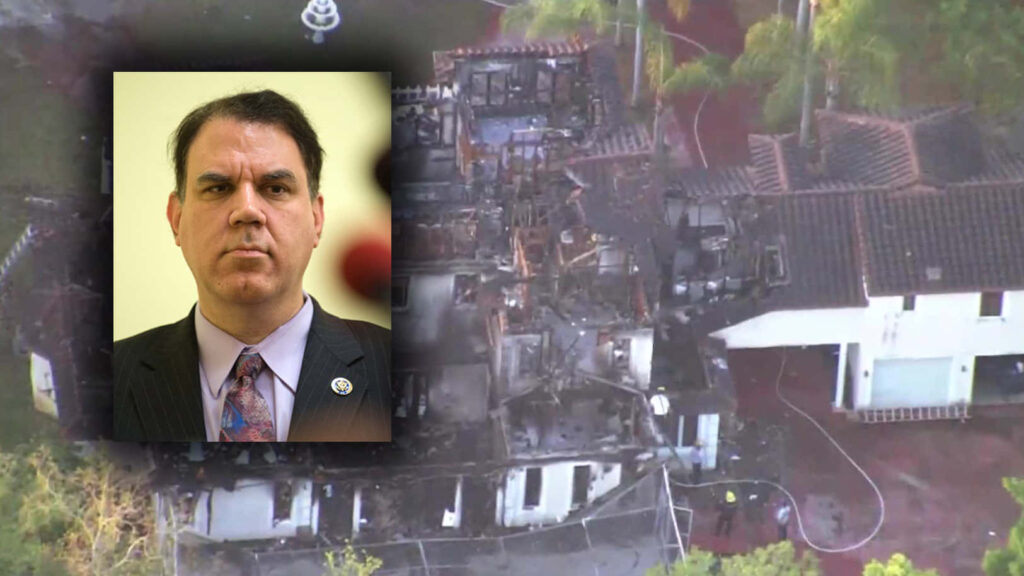 Alan Grayson in front of house destroyed by fire capturing political calamity wallpaper background