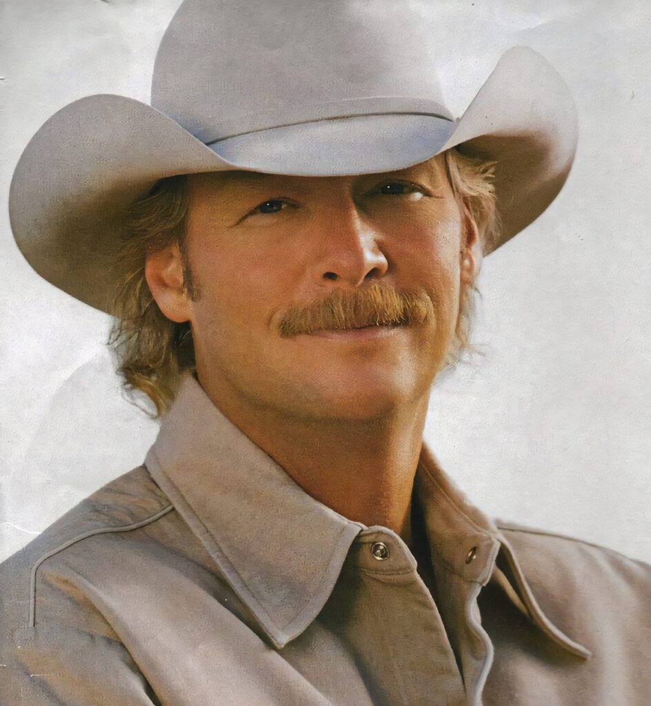 Alan Jackson in classic cowboy hat and jacket on soft white background country music style wallpaper