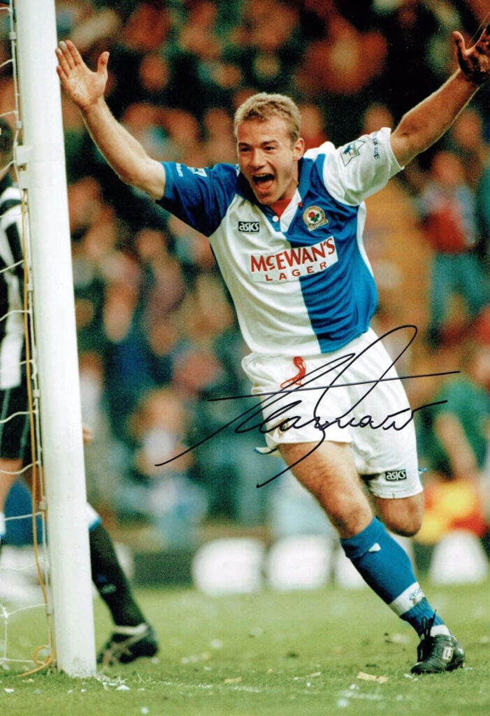 Alan Shearer celebrating goal in Blackburn Rovers kit with autograph on wallpaper background