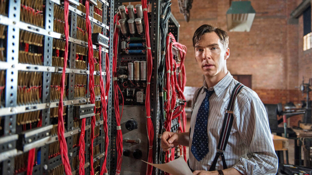 Alan Turing beside codebreaking machines from The Imitation Game movie wallpaper background