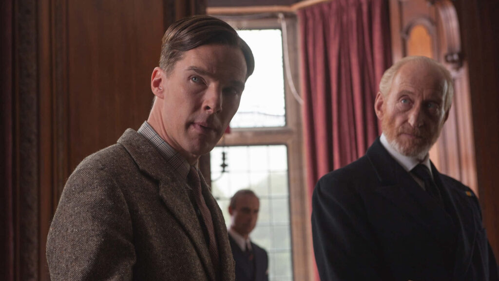 Alan Turing and Commander Denniston in tense wartime scene from The Imitation Game with vintage decor Wallpaper