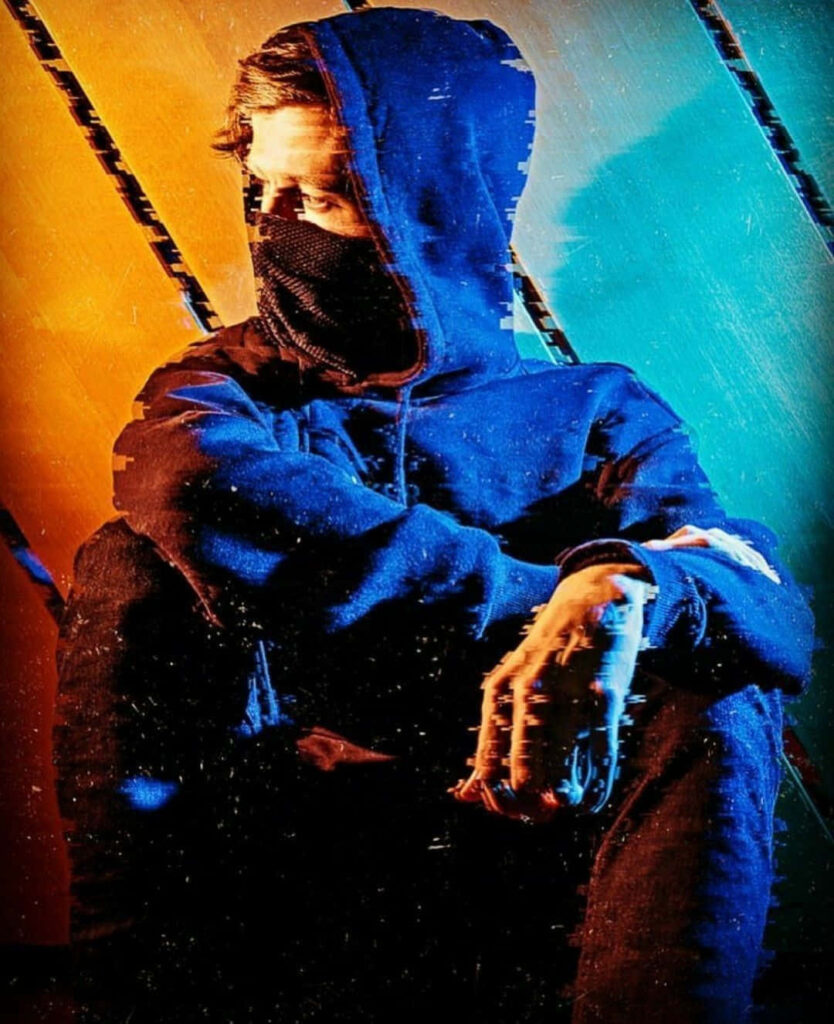 The Enigmatic Alan Walker: Unveiling Musical Magic amidst Mesmerizing Stage Spectacle Wallpaper