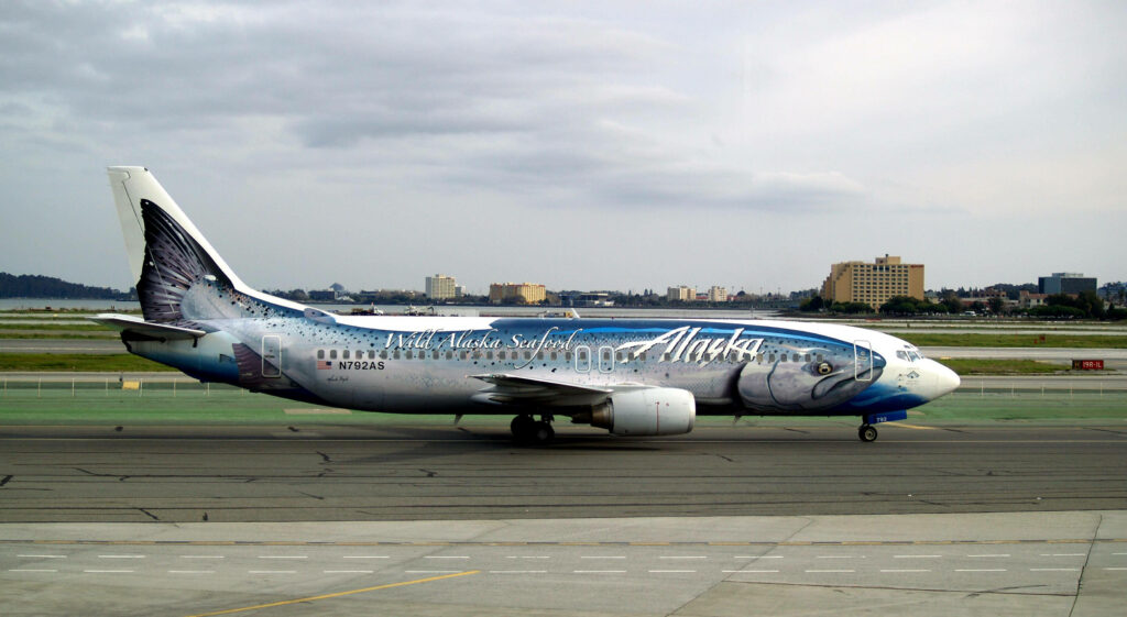 Vibrant Alaska Airlines Airplane Wallpaper with Seafood Mural