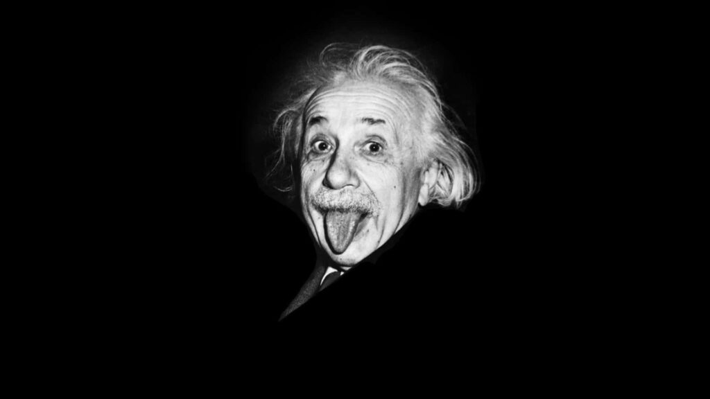 Albert Einstein playful portrait wallpaper with iconic expression on bold black background