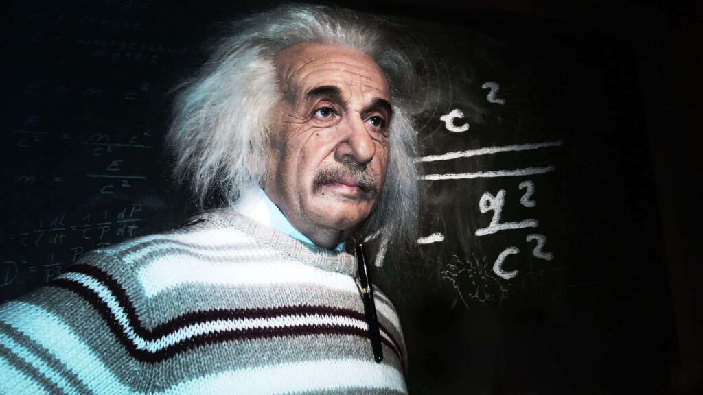 Albert Einstein thoughtful expression in front of blackboard with complex scientific equations wallpaper