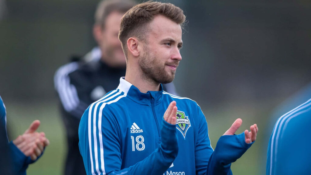 Albert Rusnák clapping in Seattle Sounders training gear during team session wallpaper background