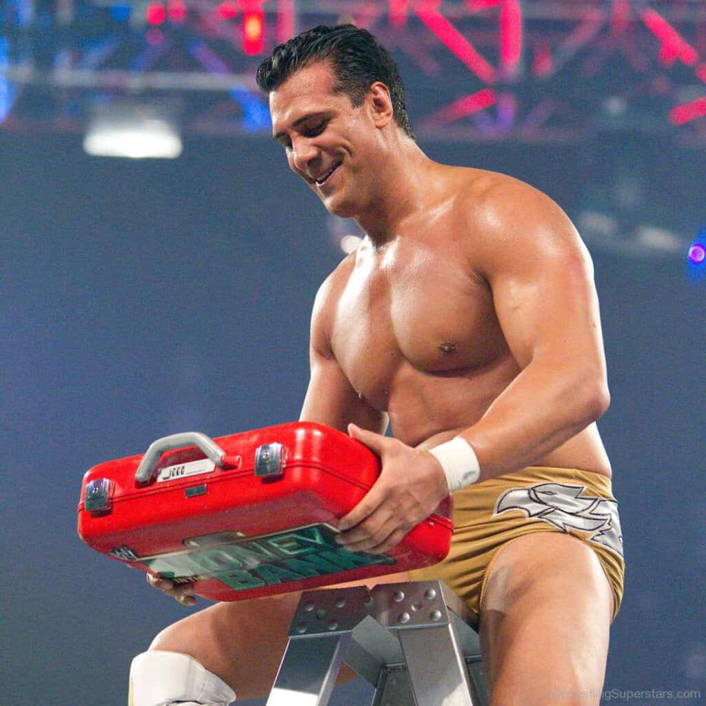 Alberto Del Rio celebrates victory holding red Money in the Bank suitcase on ladder in ring Wallpaper