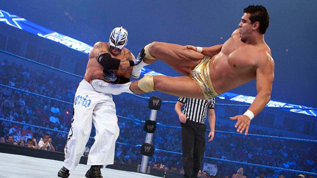 Alberto Del Rio kicks Rey Mysterio in intense WWE wrestling match high-flying action wallpaper