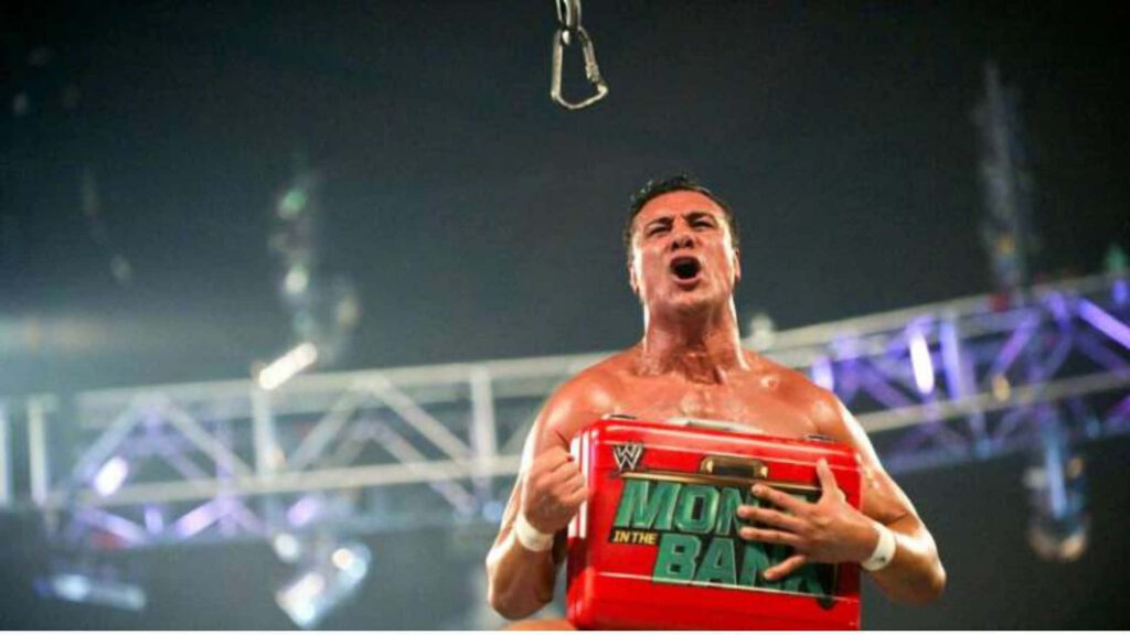 Alberto Del Rio triumphs in wrestling ring holding Money in the Bank briefcase spotlight wallpaper