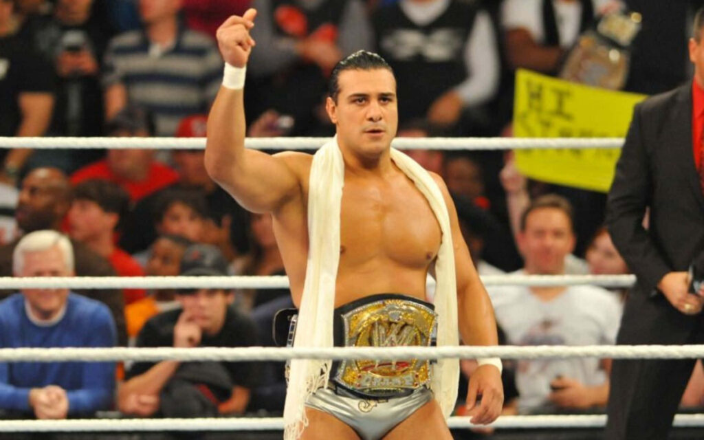 Alberto Del Rio WWE Champion in ring with enthusiastic crowd dynamic wrestling wallpaper background