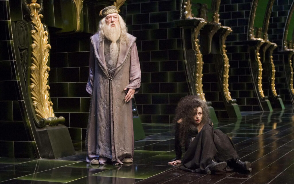 Albus Dumbledore and Bellatrix Lestrange intense showdown in ornate Harry Potter hall wallpaper