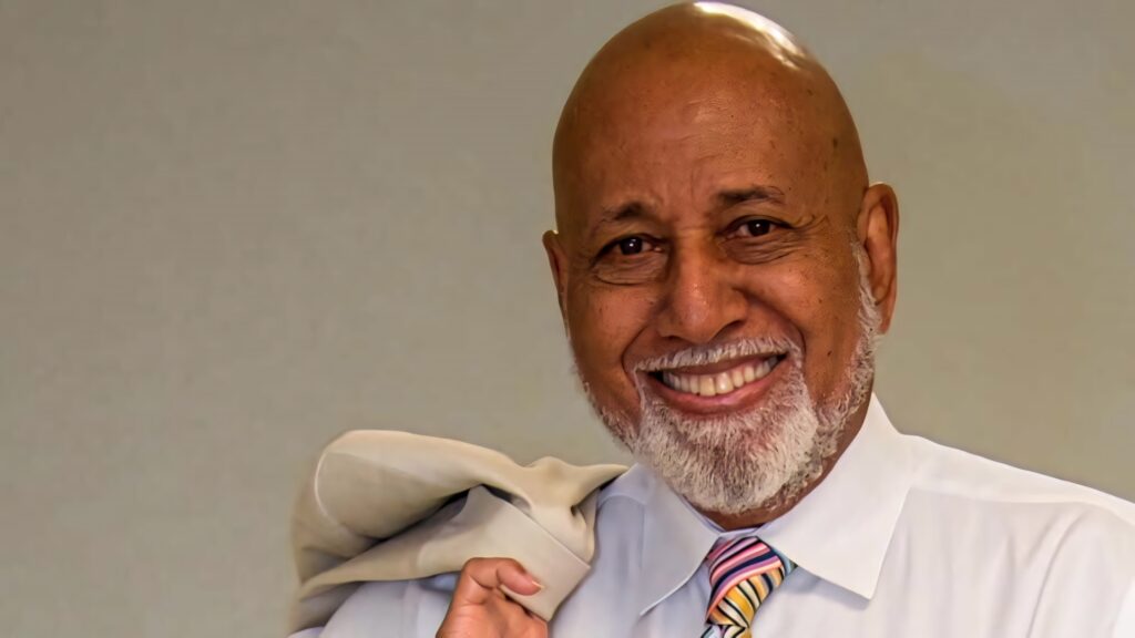 Alcee Hastings confident with coat over shoulder smiling distinguished American politician wallpaper