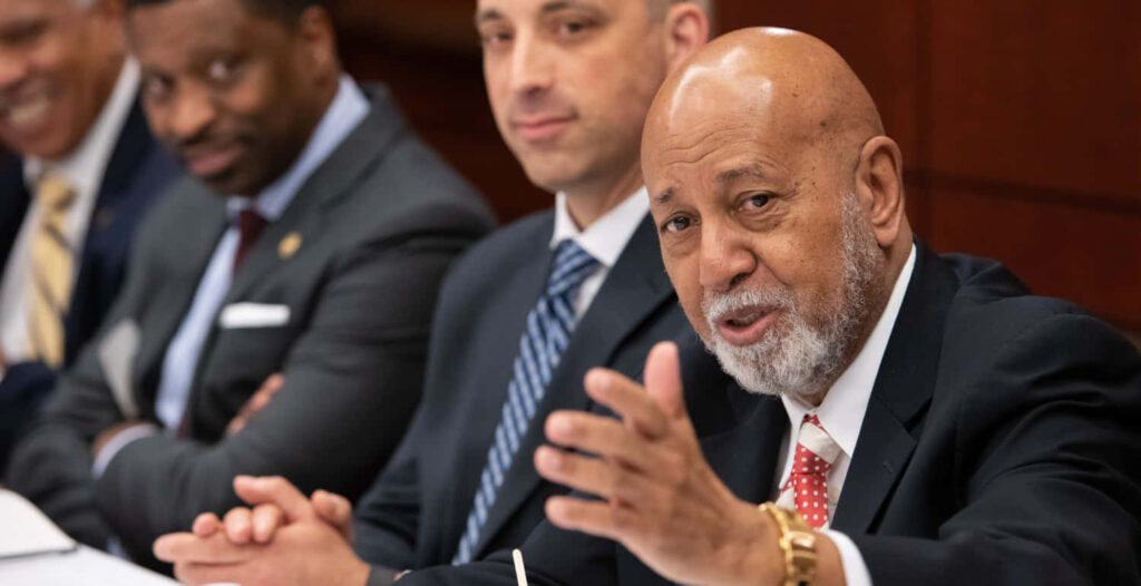 Alcee Hastings speaking passionately at public forum influential American politician discussion background Wallpaper