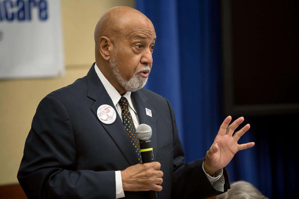 Alcee Hastings passionately speaking to an engaged audience American politician in action wallpaper