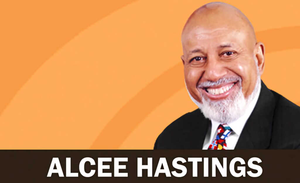 Alcee Hastings smiling portrait with vibrant orange background and bold curved accents wallpaper