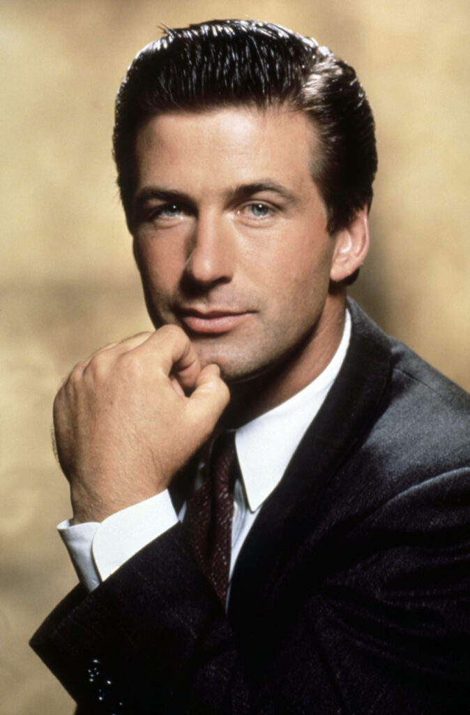 Alec Baldwin confident youthful portrait sharp suit classic wallpaper background style