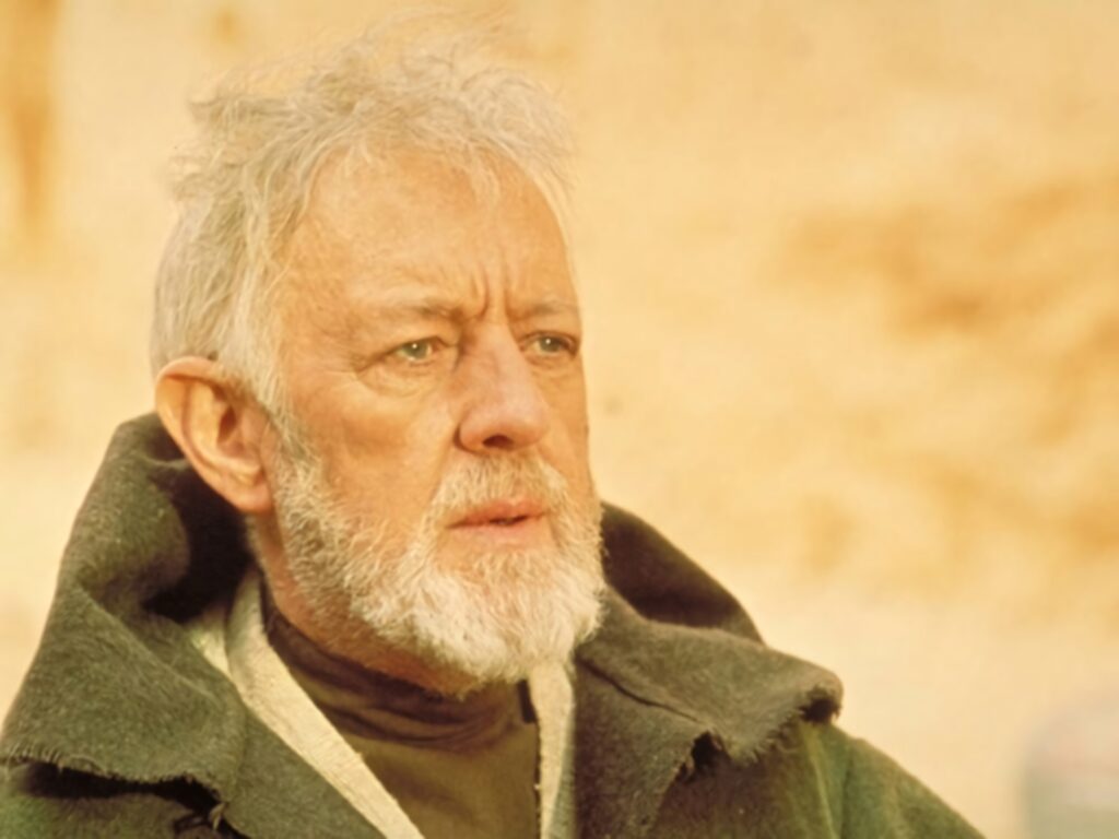 Alec Guinness thoughtful expression classic scene yellow tinted wallpaper background image