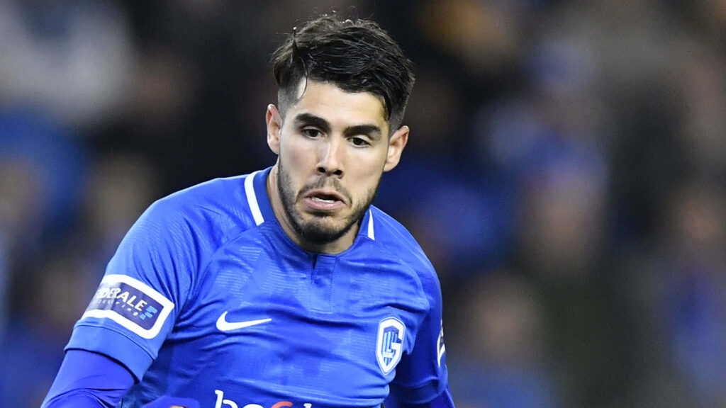 KRC Genk midfielder Alejandro Pozuelo in blue kit sprinting during intense football match action Wallpaper