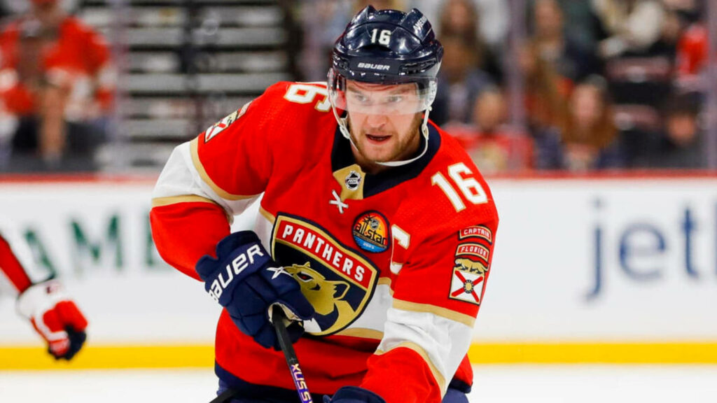 Aleksander Barkov skating intensely in Florida Panthers uniform NHL game action wallpaper background