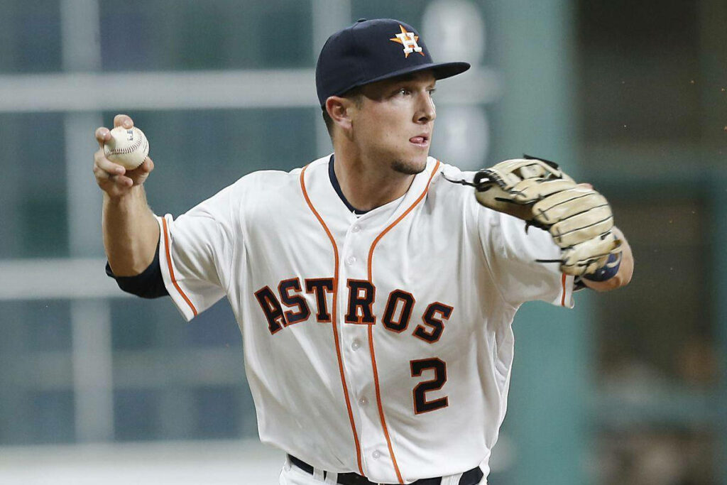 Alex Bregman Houston Astros baseball player poised to make play holding ball and glove wallpaper
