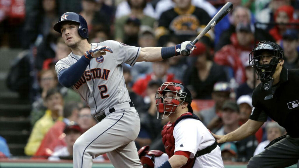 Alex Bregman Houston Astros swinging bat focused on baseball dynamic action wallpaper background