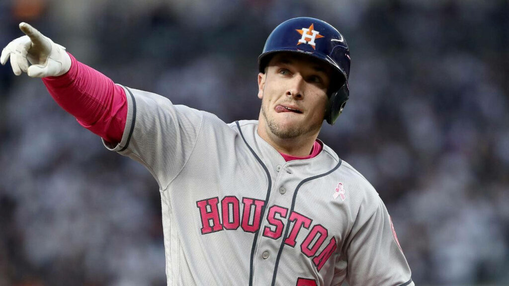 Alex Bregman in Houston Astros uniform pointing with determination and playful tongue out Wallpaper