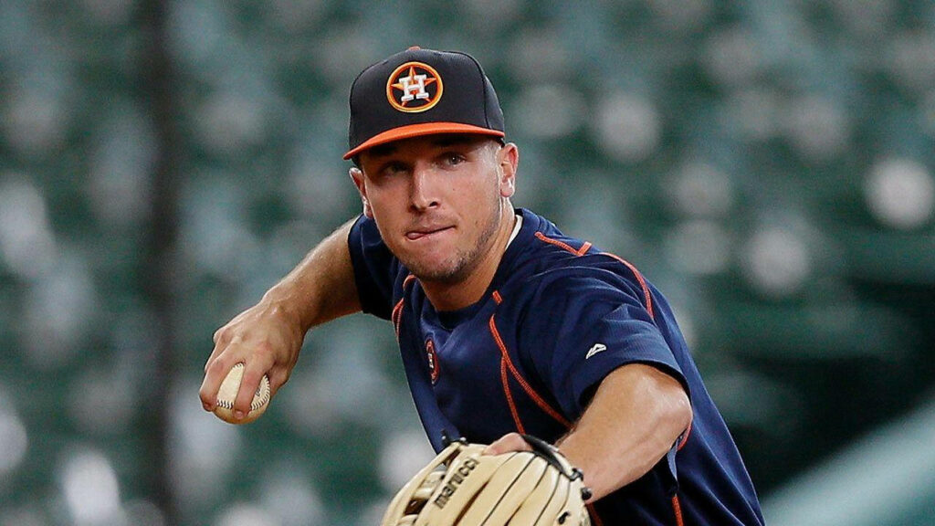Close-up of Alex Bregman focused throwing baseball during practice showcasing athleticism wallpaper