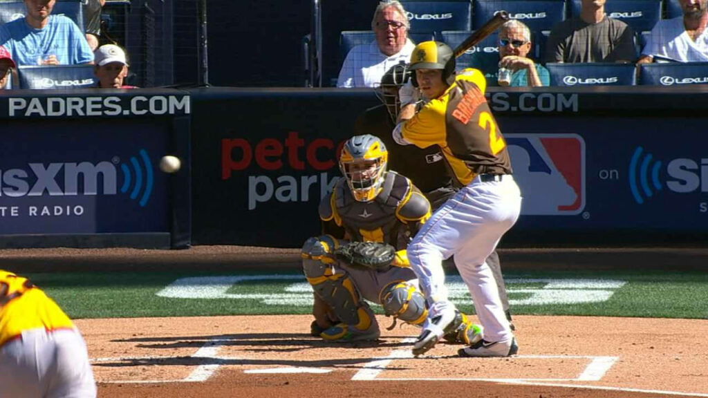 Alex Bregman in LSU baseball uniform swinging bat mid-pitch with intense focus wallpaper background