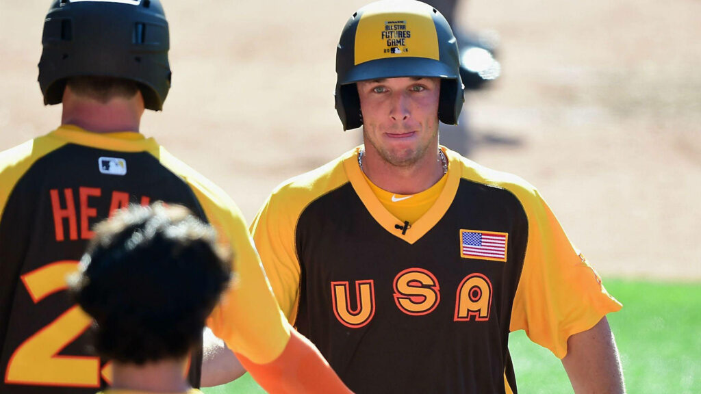 Alex Bregman and teammates in USA baseball jerseys showing team spirit on field wallpaper