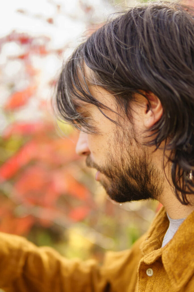 Alex G deep in thought autumn background warm reflective wallpaper for desktop and mobile