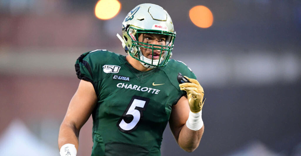 Charlotte football player Alex Highsmith in green number 5 uniform ready for game action wallpaper