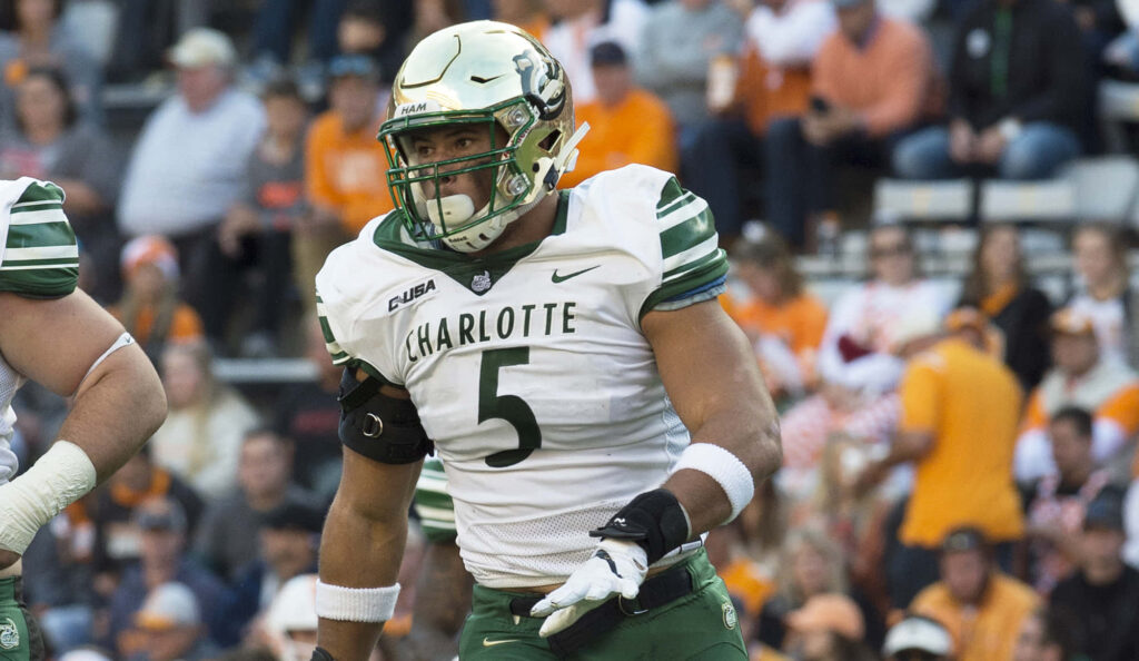 Alex Highsmith in Charlotte football uniform number 5 on field vibrant sports wallpaper background