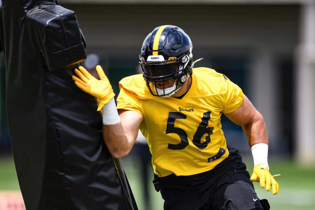 Alex Highsmith in Steelers number 56 jersey focused during football training drill wallpaper background