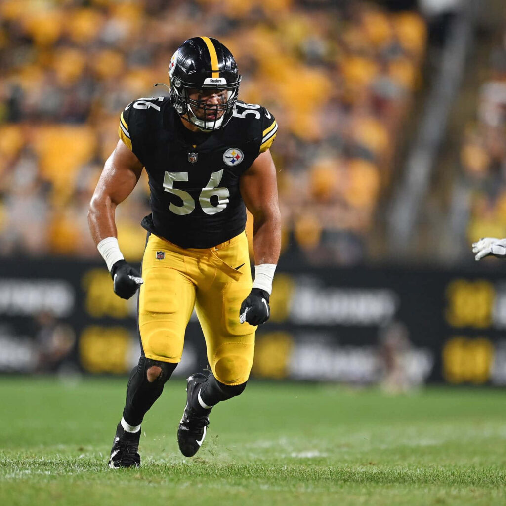 Alex Highsmith Pittsburgh Steelers in action showcasing athleticism and focus on football field Wallpaper