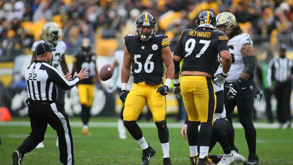 Alex Highsmith and Pittsburgh Steelers defense intense game action wallpaper background