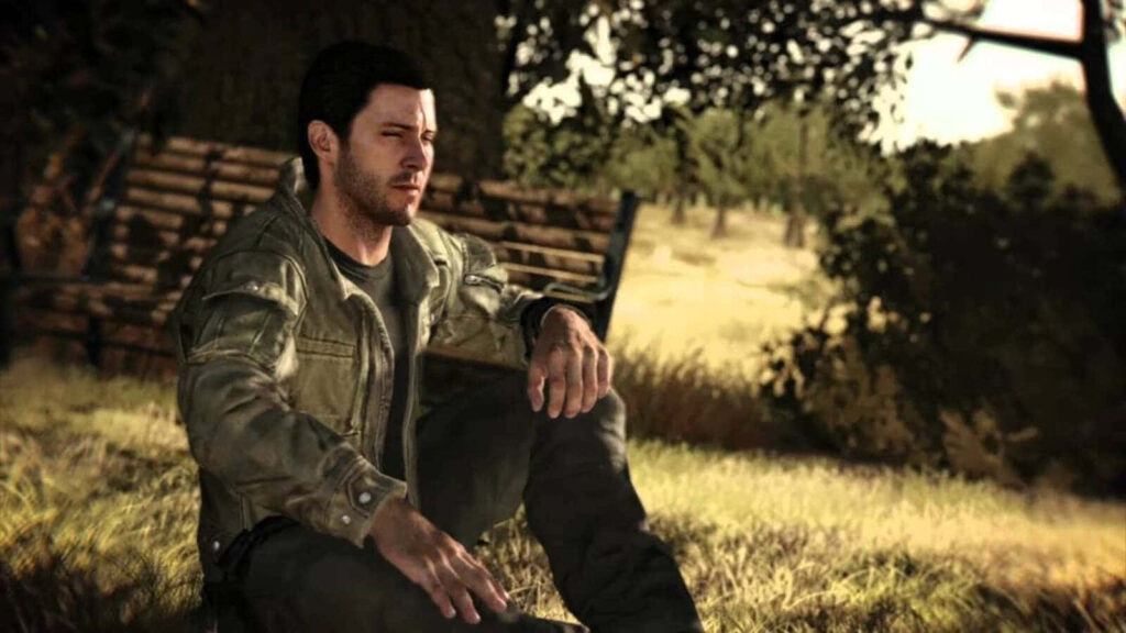 Alex Mason thoughtful in sunlit forest clearing wearing rugged jacket sitting calm on grass wallpaper