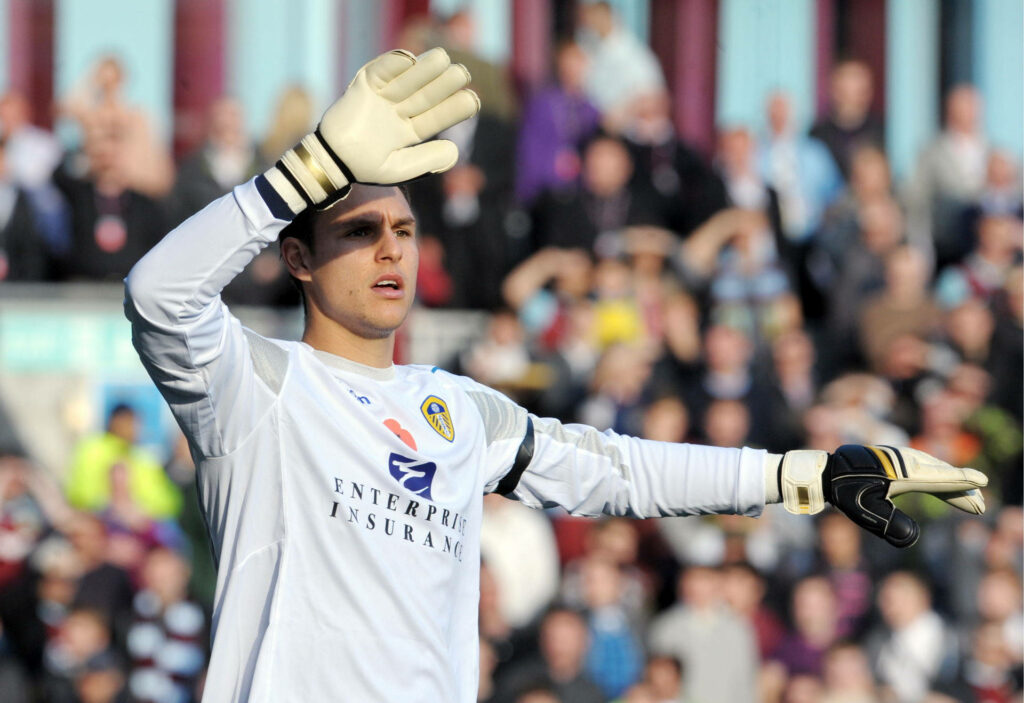 Alex McCarthy goalkeeper directing team on football field with crowd in background wallpaper