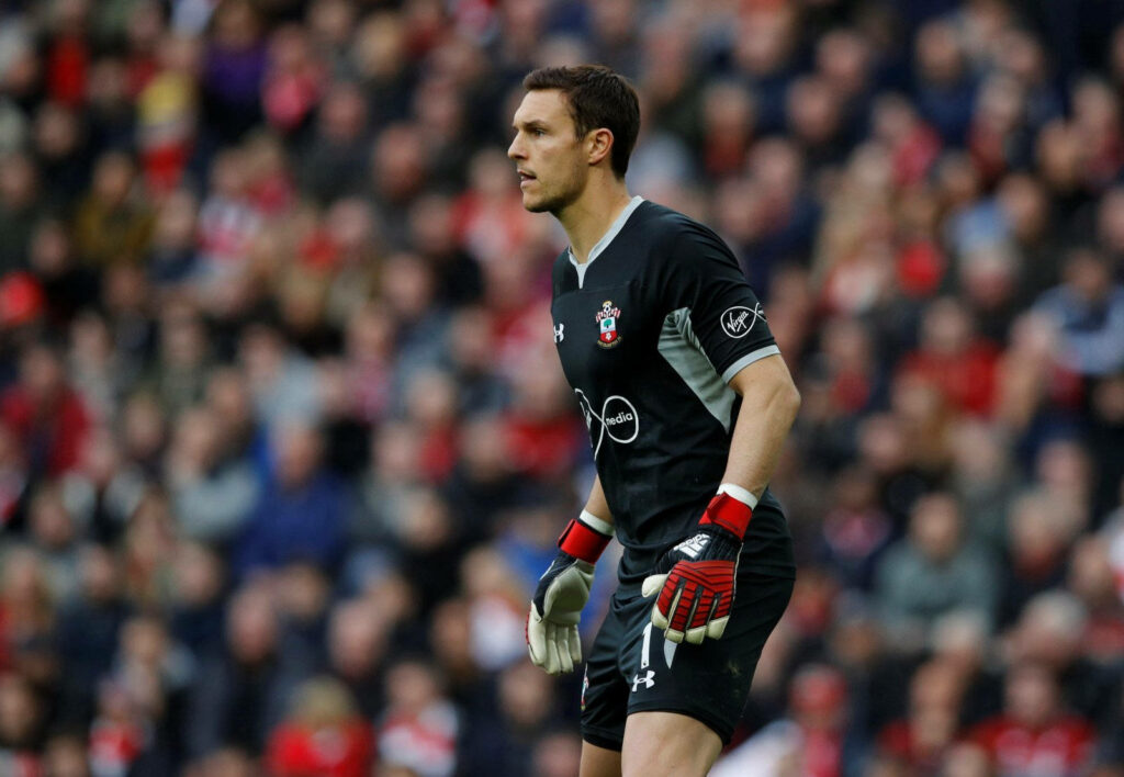Alex McCarthy in Southampton kit focused and ready to guard goal during football match wallpaper